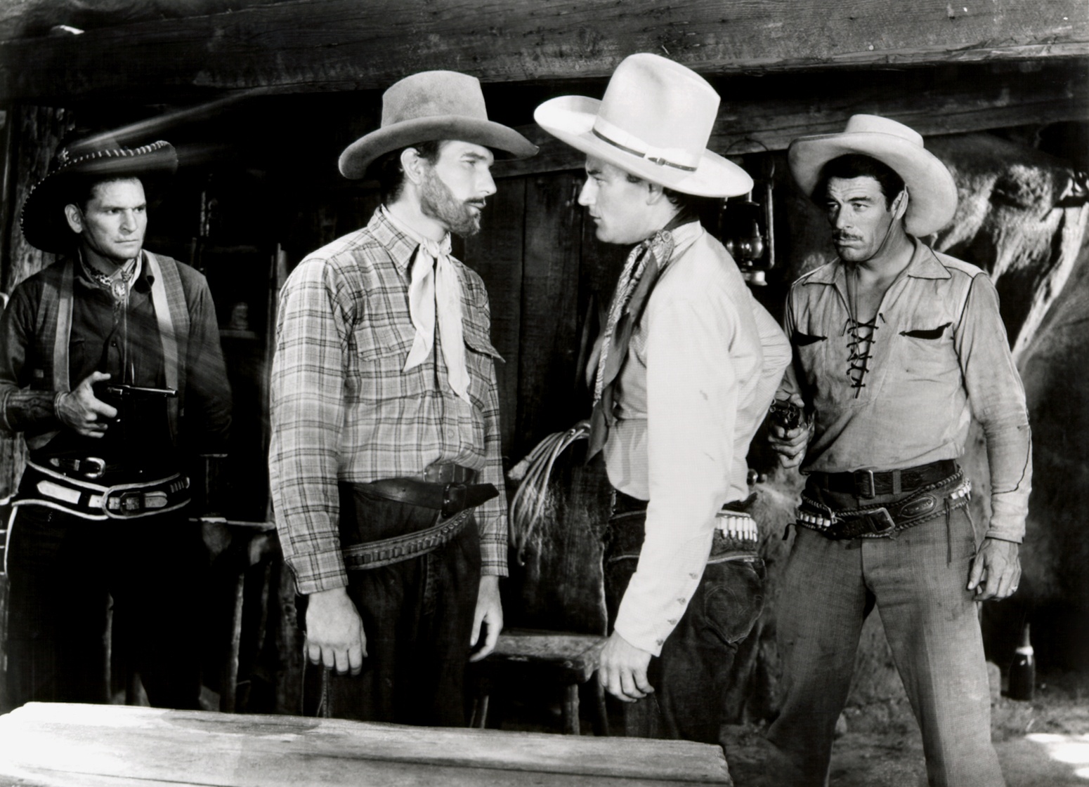 L to R) Yakima Canutt, Unknown, John Wayne, Glenn Strange.